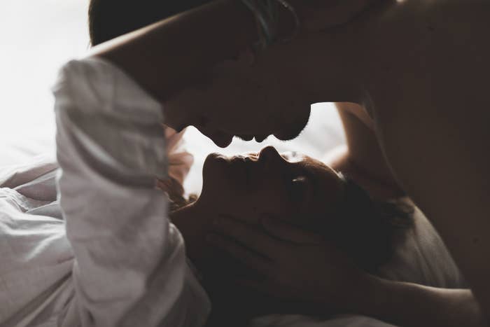 Stock image of a couple embracing and going in for a kiss