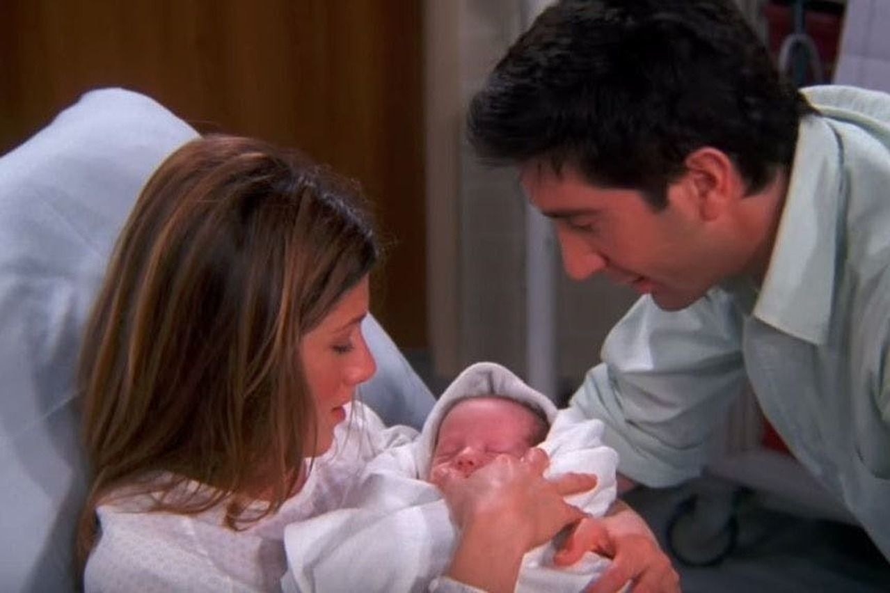 Ross and Rachel with a newborn in the hospital