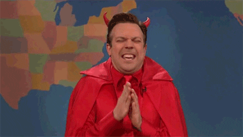 Jason Sudeikis dressed as the devil, laughing maniacally