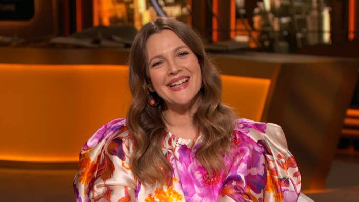 Drew sits on the set of her show