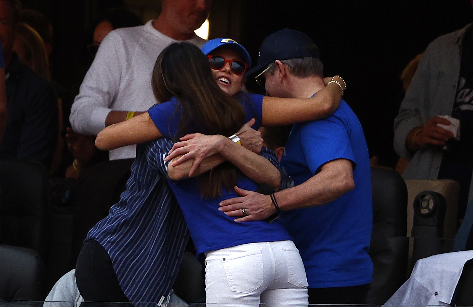 Charlize hugs Matt and Luciana Barroso
