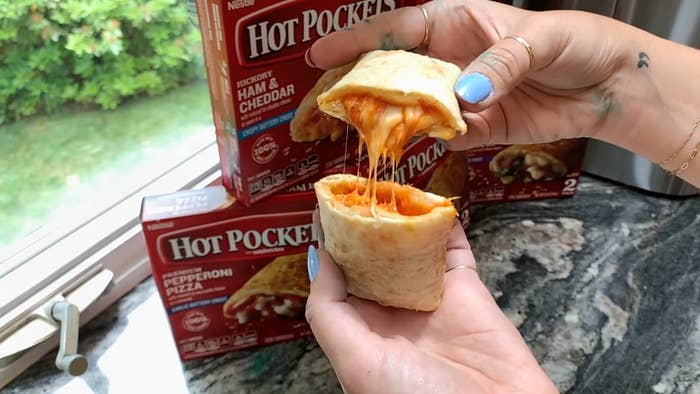 Woman pulling apart Hot Pocket