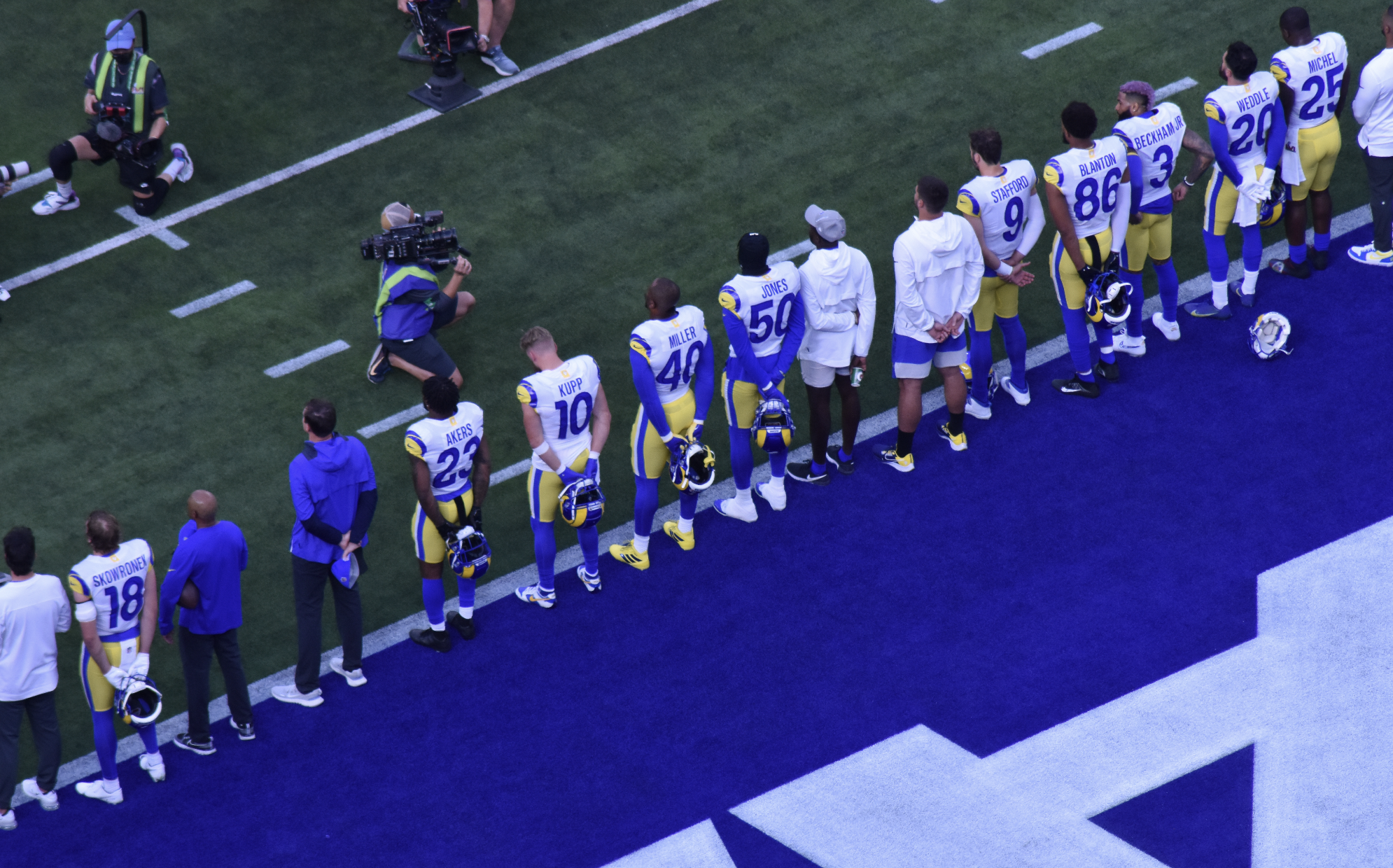 The Rams line up during the National Anthem