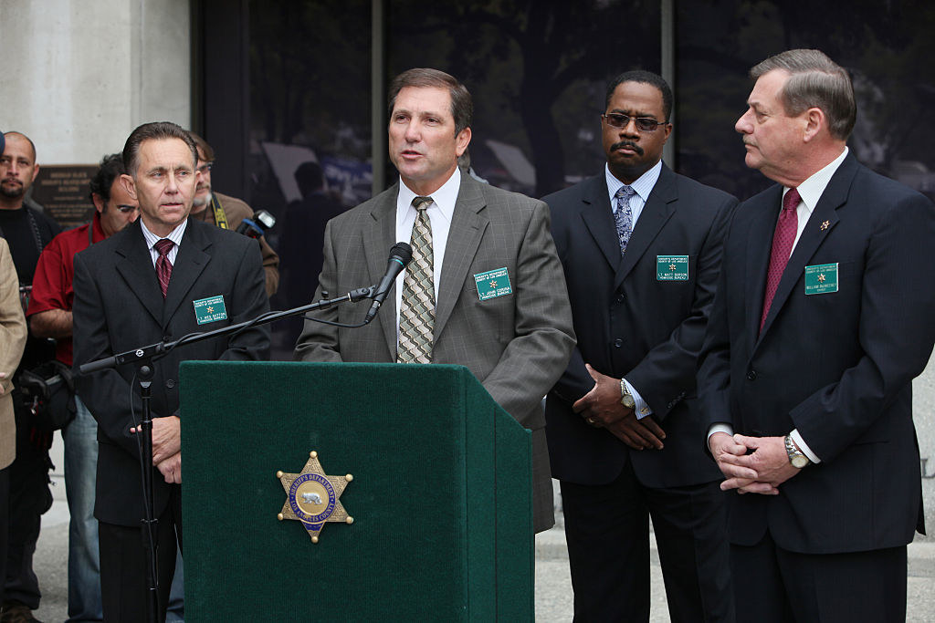 Investigators speak at a press conference in 2018