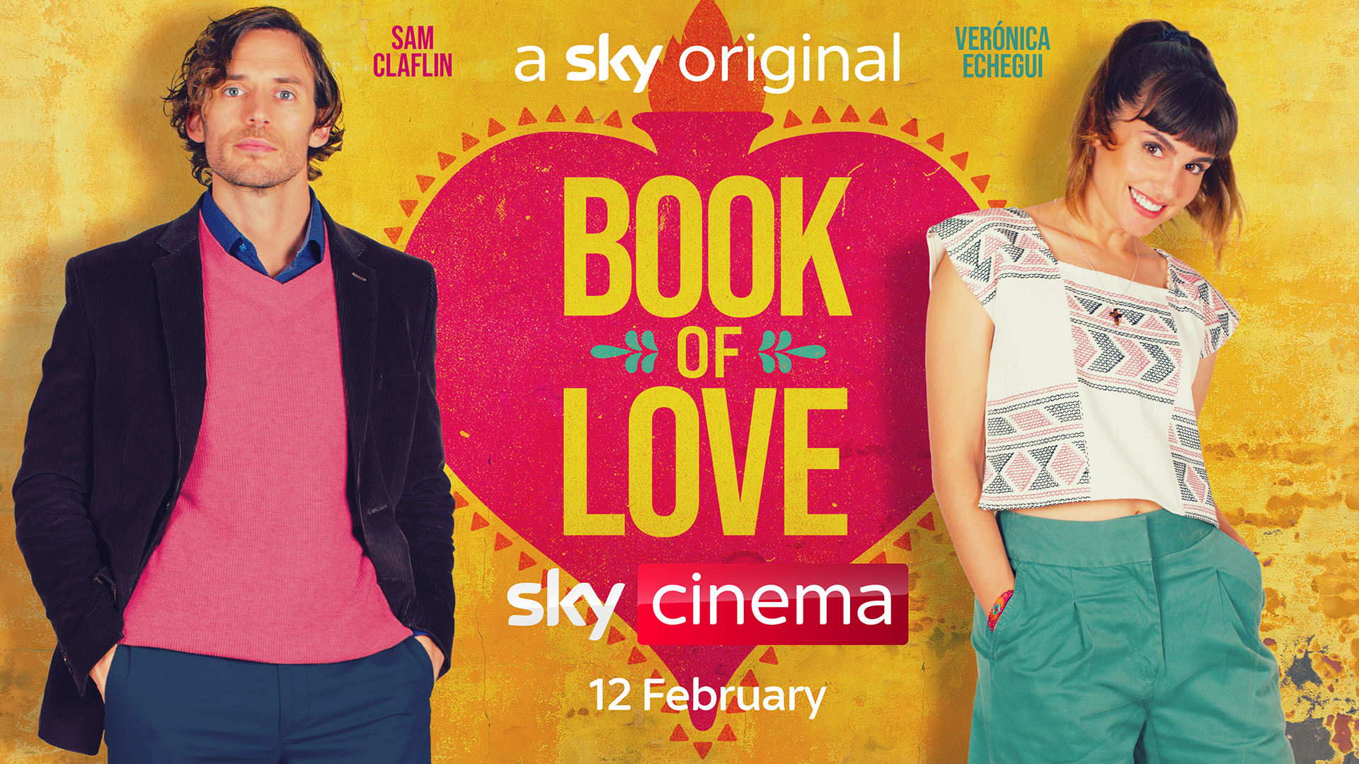 The Book Of Love poster, with Sam Claflin in a pink jumper and black blazer on the left and Veronica Echegui in a white t-shirt patterned with pink and grey arrows and green trousers on the right, both with their hands in their pockets