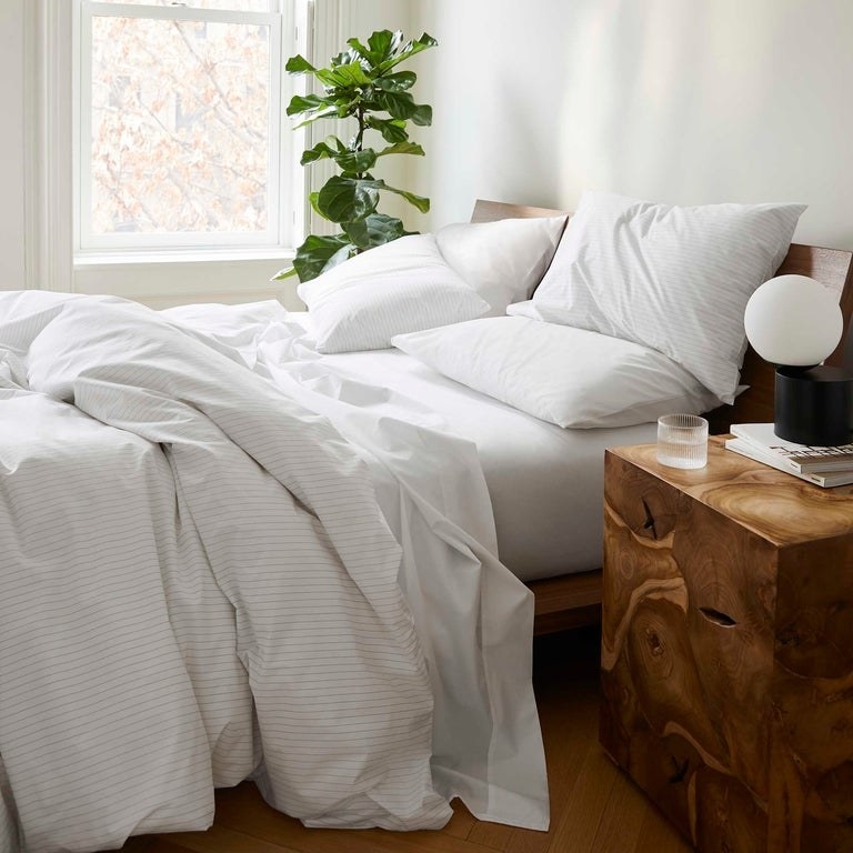 the Luxe Core Sheet Set on a bed in white