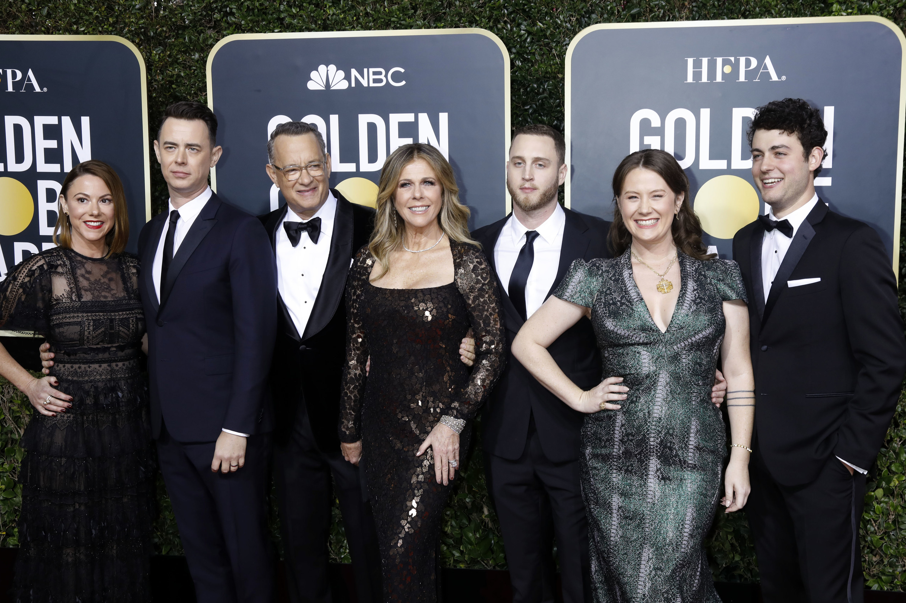 Tom and Rita posing with their family on the Golden Globes red carpet