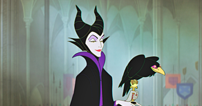 Maleficient stands with her crow perched on her staff