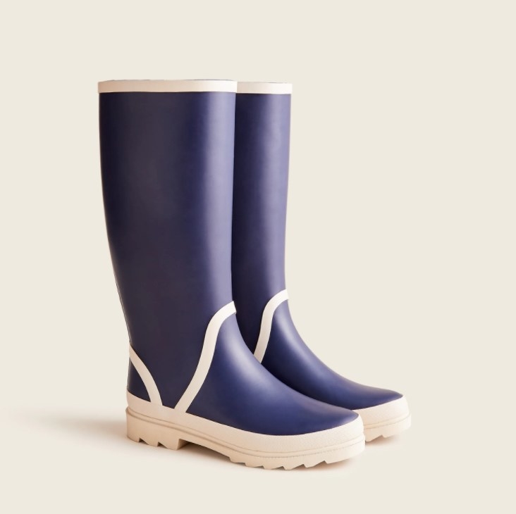 An image of a pair of tall rainboots with a rubber upper and sole