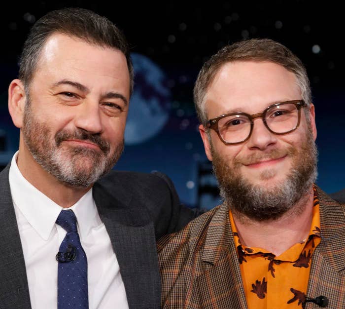 Jimmy and Seth standing side-by-side and smiling for a photo on set