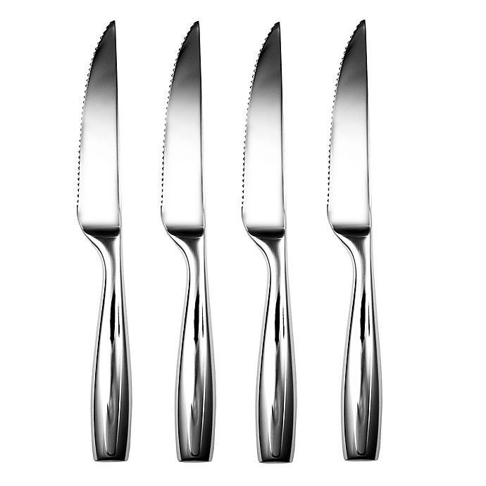 a set of four silver serrated steak knives