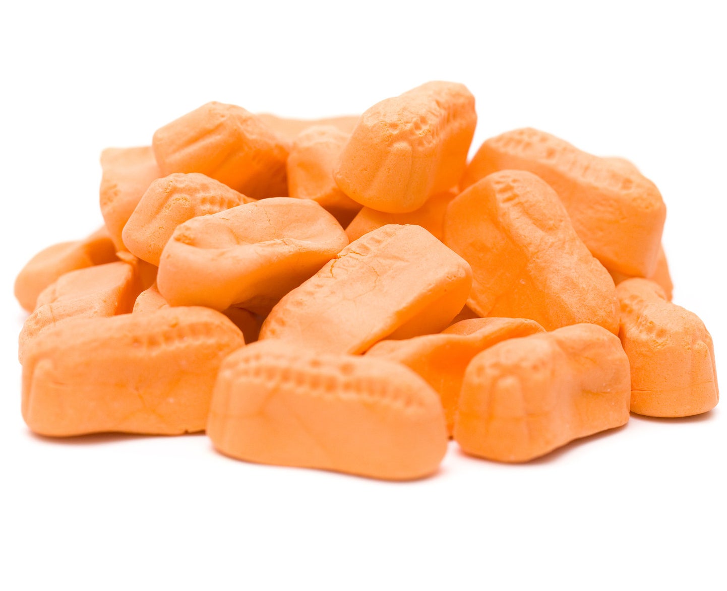 Orange candy peanuts on a white background.