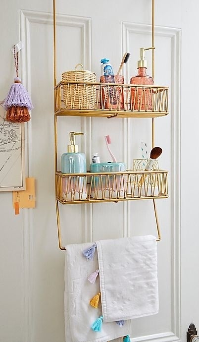 the 2-tiered door caddy holding beauty products