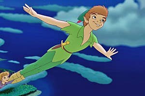 Peter Pan flies through the night sky with his arms outstretched
