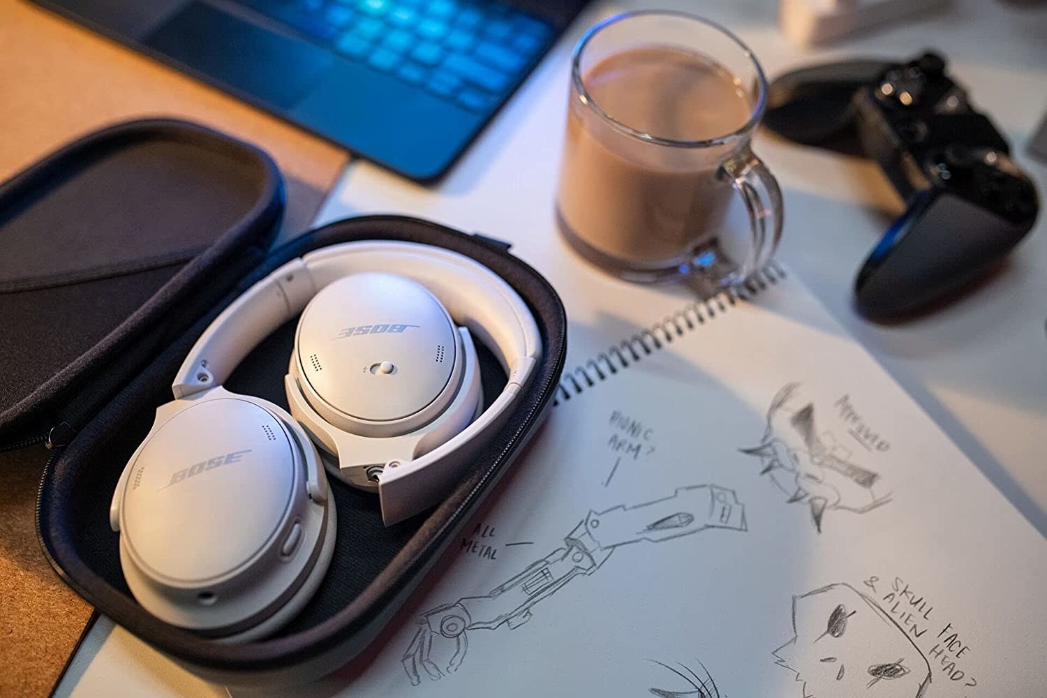 the white bose headphones in their case on a desk