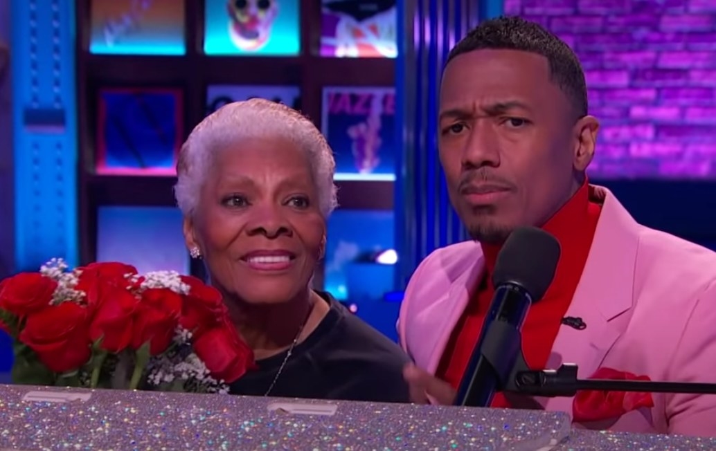 Dionne Warwick is given red roses by Nick Cannon on his show
