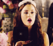 Blair re-touching her lipstick