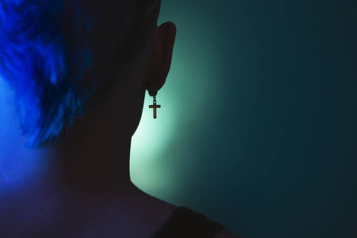 lesbian with cross earring