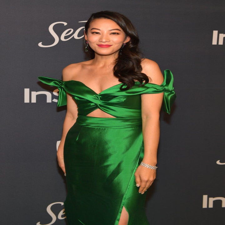 Arden rocking an off-the-shoulder dress with a slit