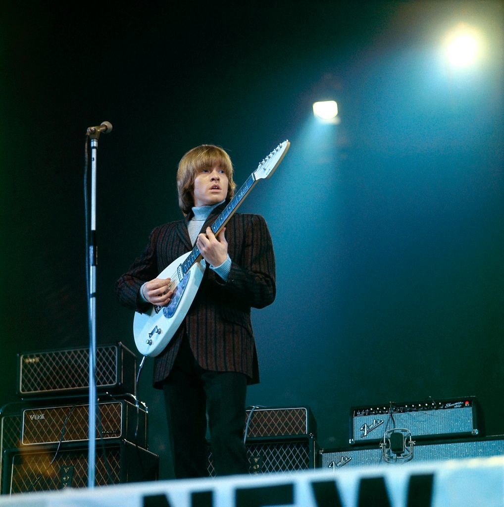 Jones playing guitar on stage