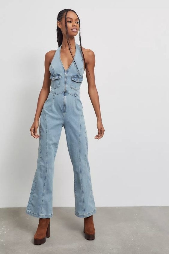 Model wearing the jumpsuit with ankle boots
