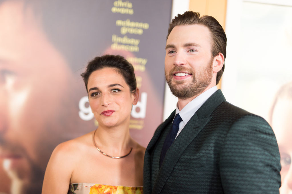 dressed in bold colors, the couple/costars pose together on the red carpet