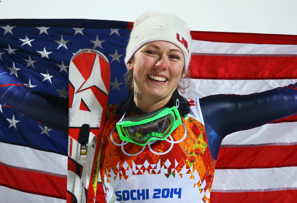 Shiffrin in 2014 with her skiis and an american flag