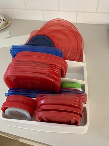 The organizer in a reviewer's drawer holding tons sizes of container lids