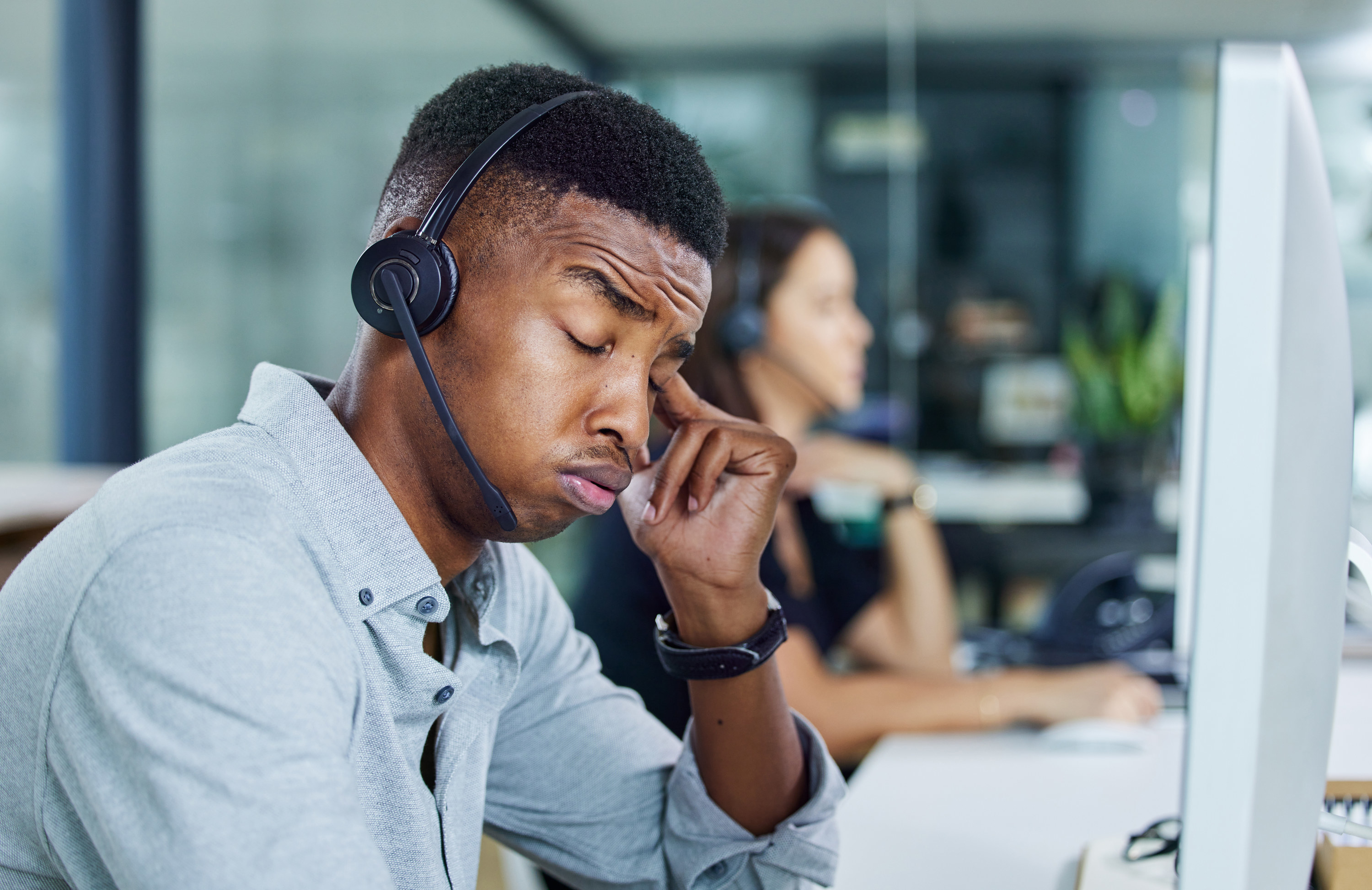 call center worker feeling stressed