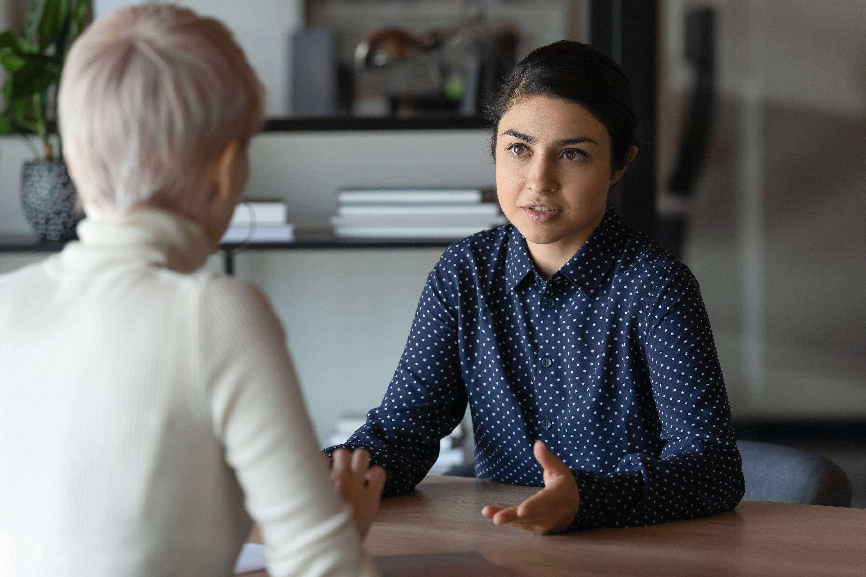 Woman talking with a colleague