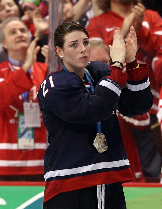Hilary clapping with a silver medal