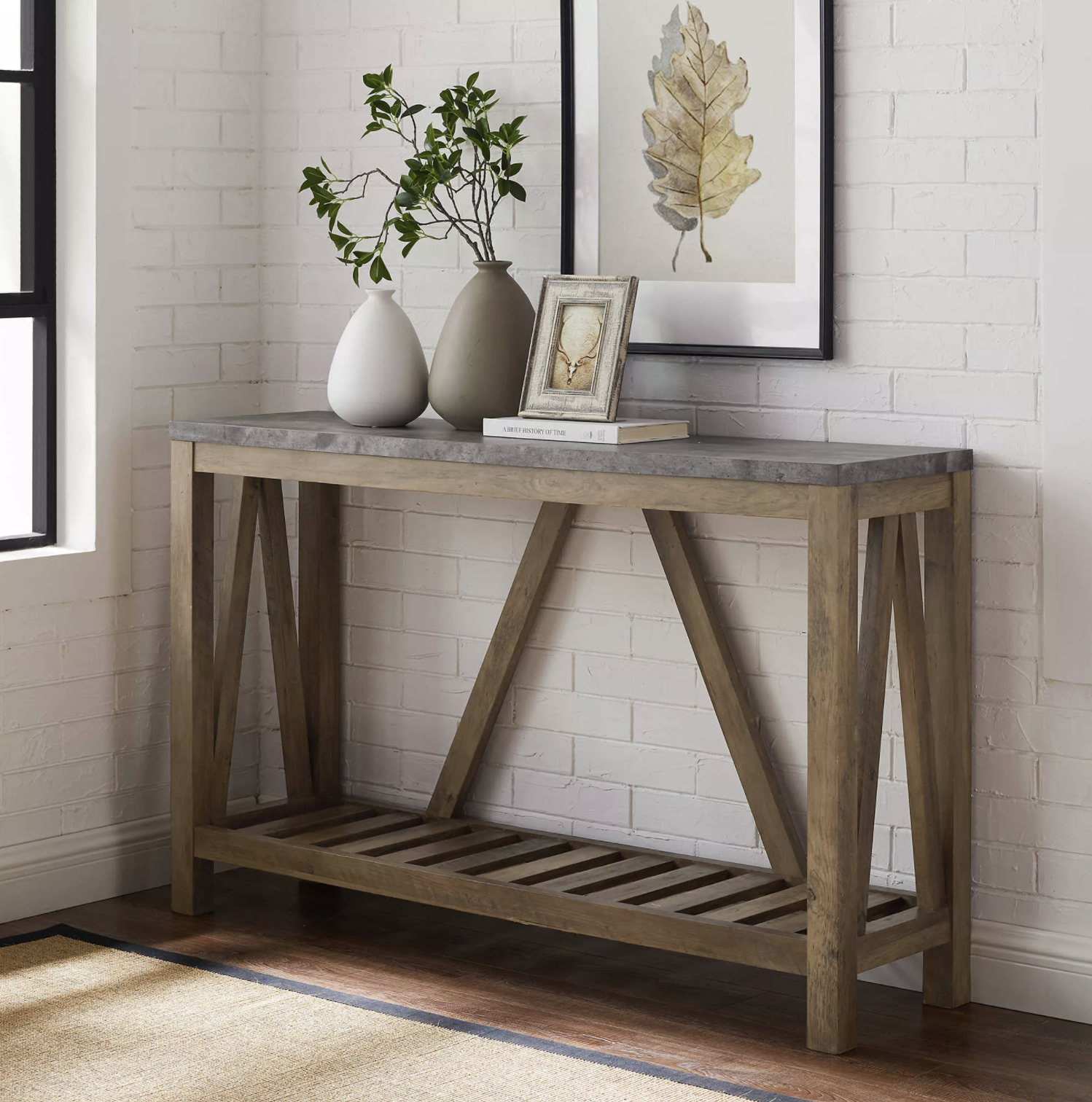 the console table in brown with decor sitting on top