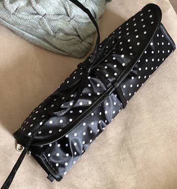 the same organizer rolled up to the size of a large wallet