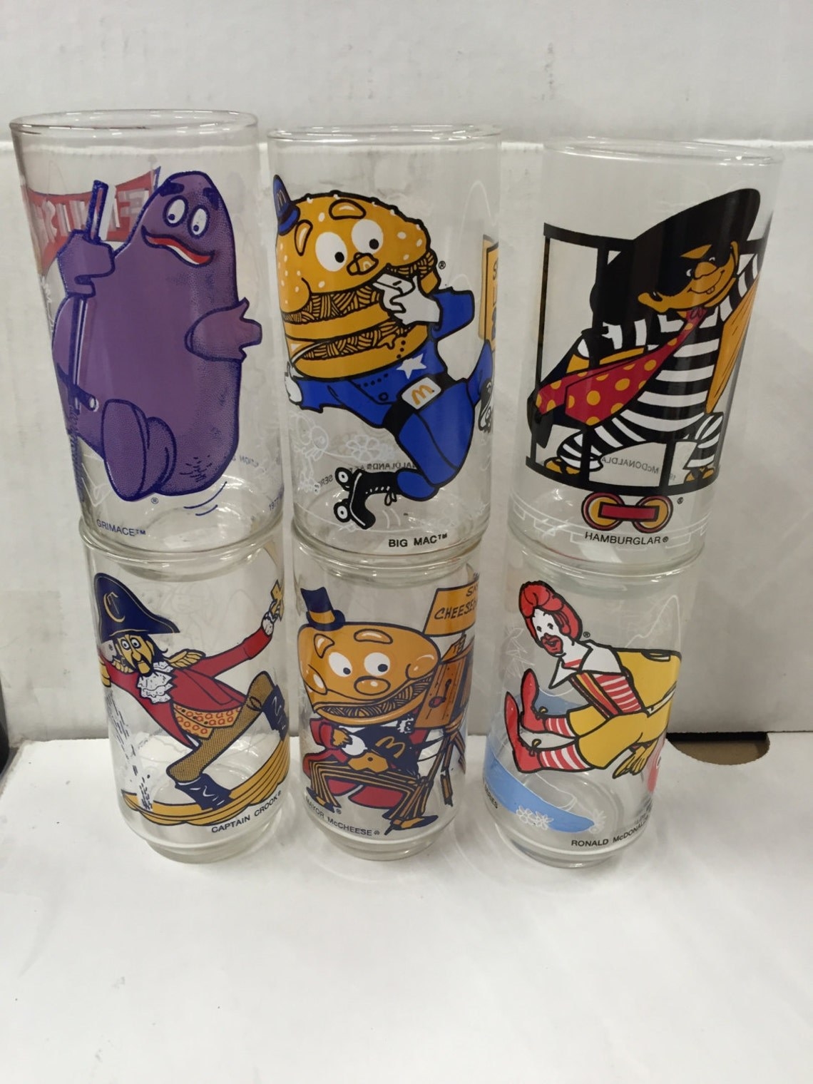 six different glasses featuring McDonald&#x27;s characters on them