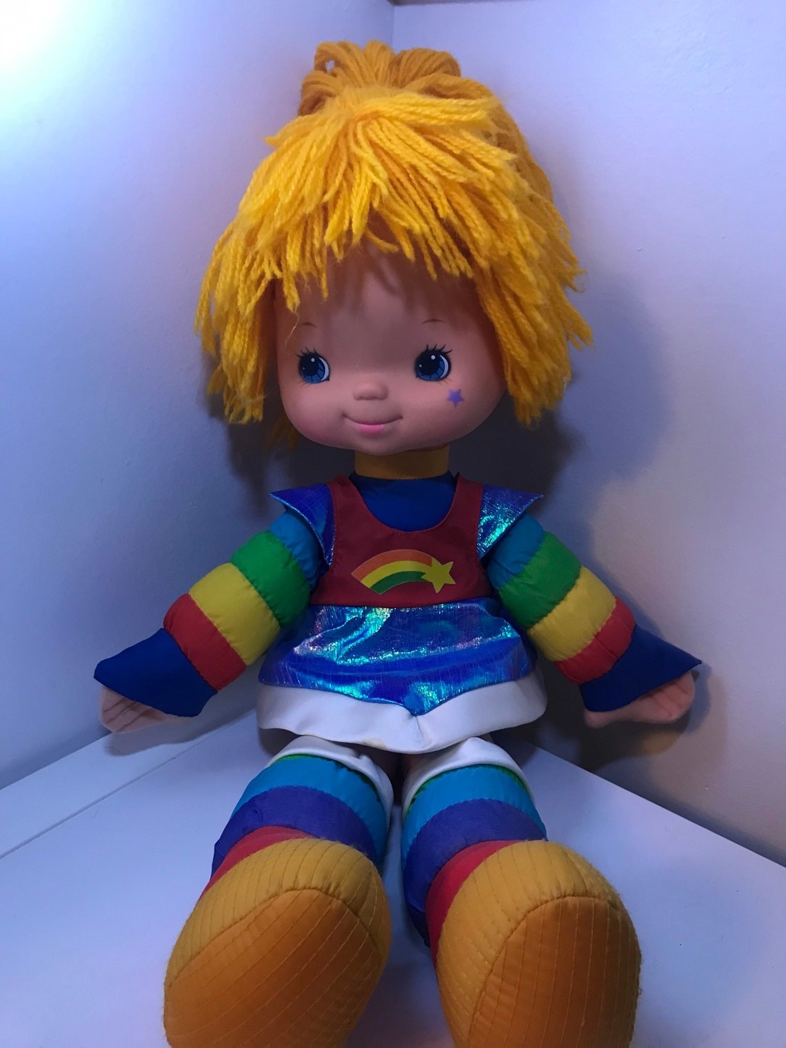 rainbow brite doll sitting down