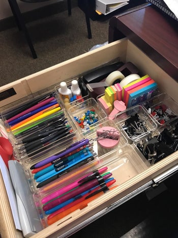 a reviewer's organized desk drawer