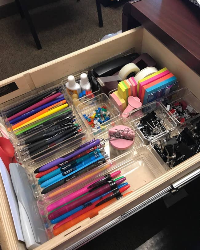 a reviewer's organized desk drawer