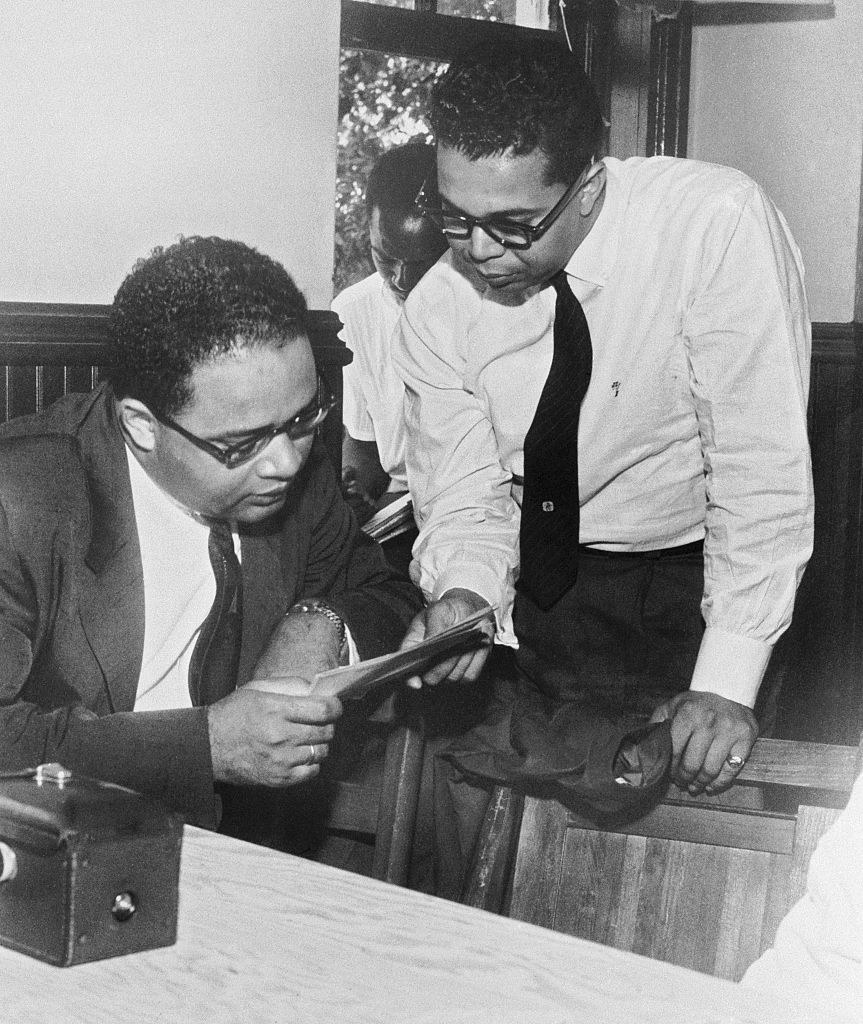United States Representative Charles Diggs, Jr. (D-Mich.) (left) consults with attorney James Del Rio