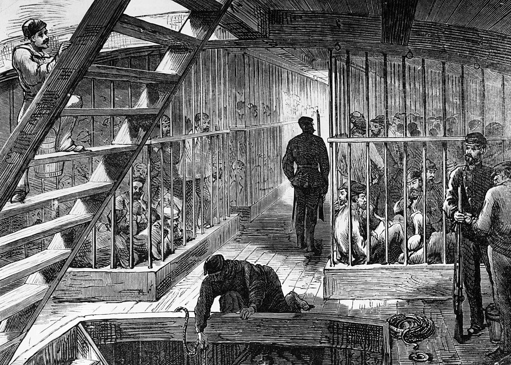 circa 1890: Caged prisoners below deck on a transport ship bound for Australia
