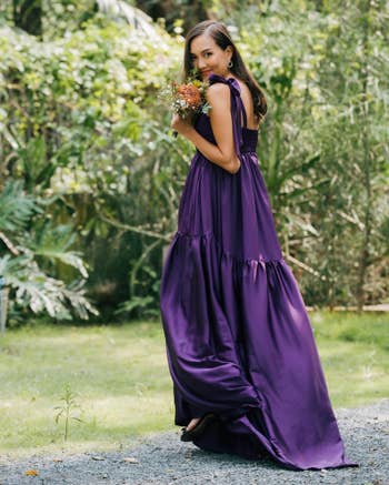A model wearing the dress in purple queen