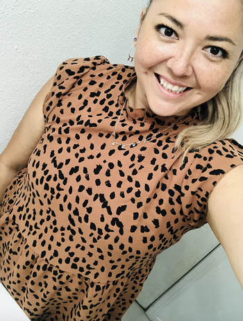 A customer review photo of them wearing the top in brown