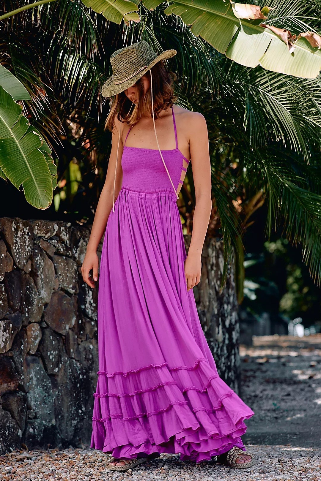 Model wearing purple maxi dress with smocked bodice and tie straps