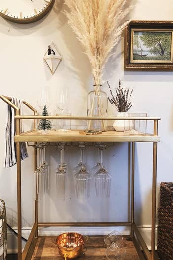 a reviewer's bar cart with the gold racks underneath