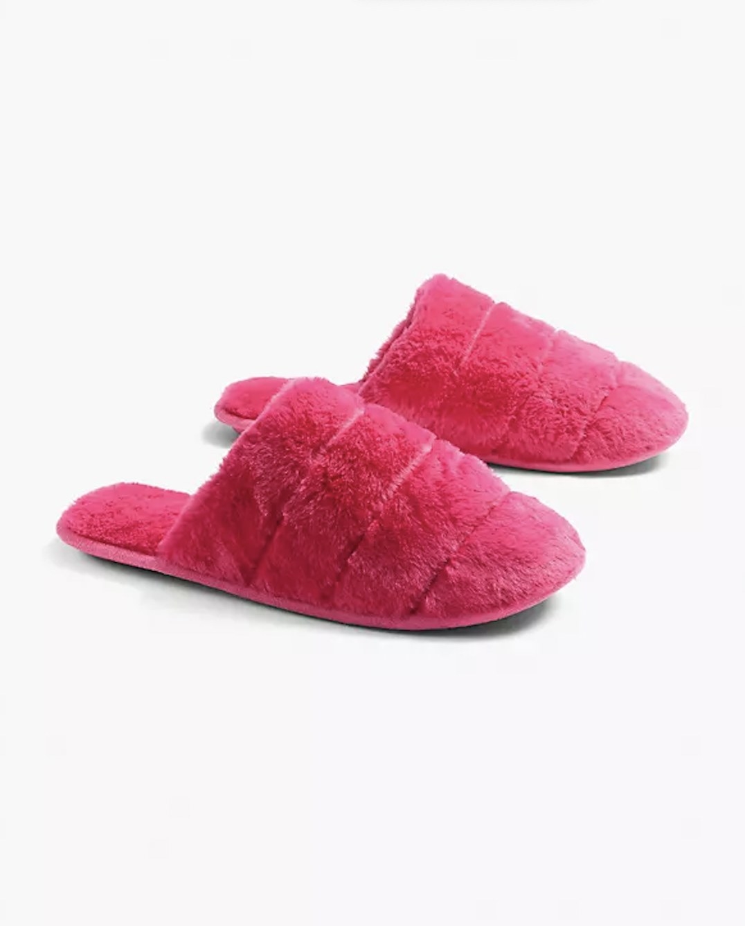 A pair of pink fur slippers