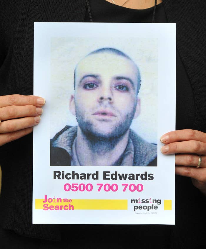 Edwards sister holds up a missing person sign of her brother