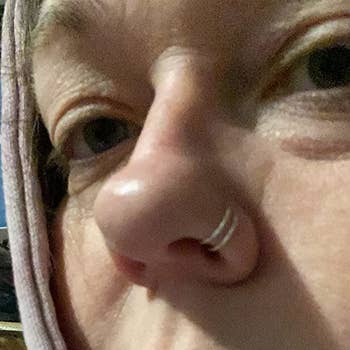 Reviewer wearing double hoop nose ring