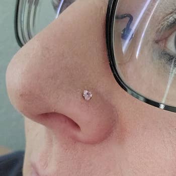 Reviewer wearing one of the nose studs