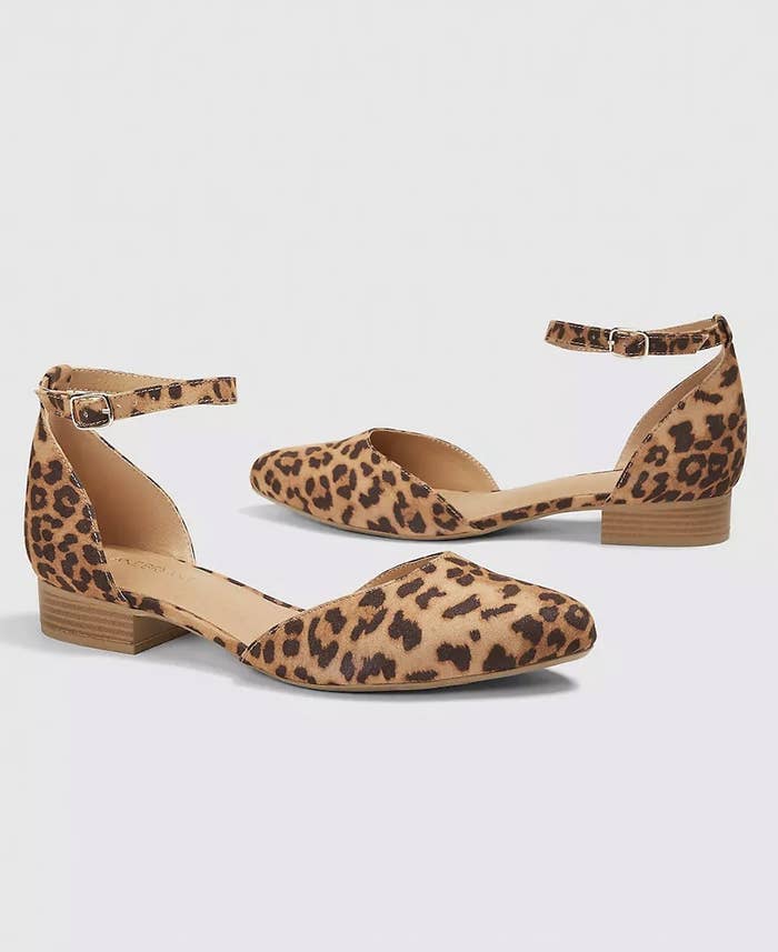 A pair of leopard print ankle strap flats