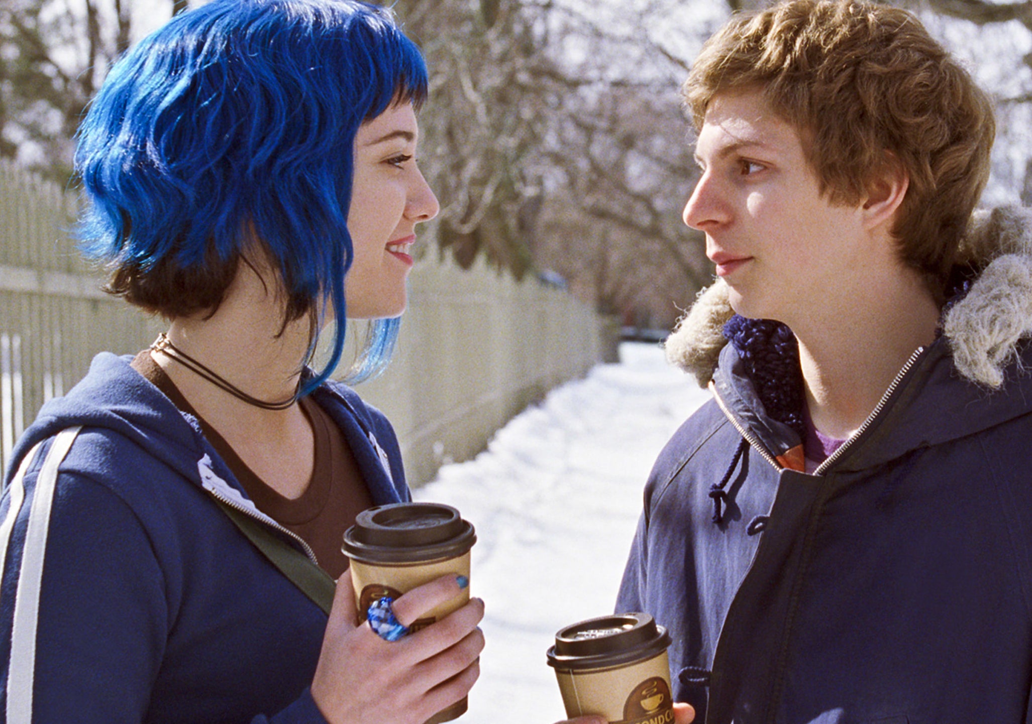 mary elizabeth winstead as Ramona flowers in scott pilgrim vs. the world with dark blue hair with dark brown by the nape of her neck and who longer strands of blue hair framing her face