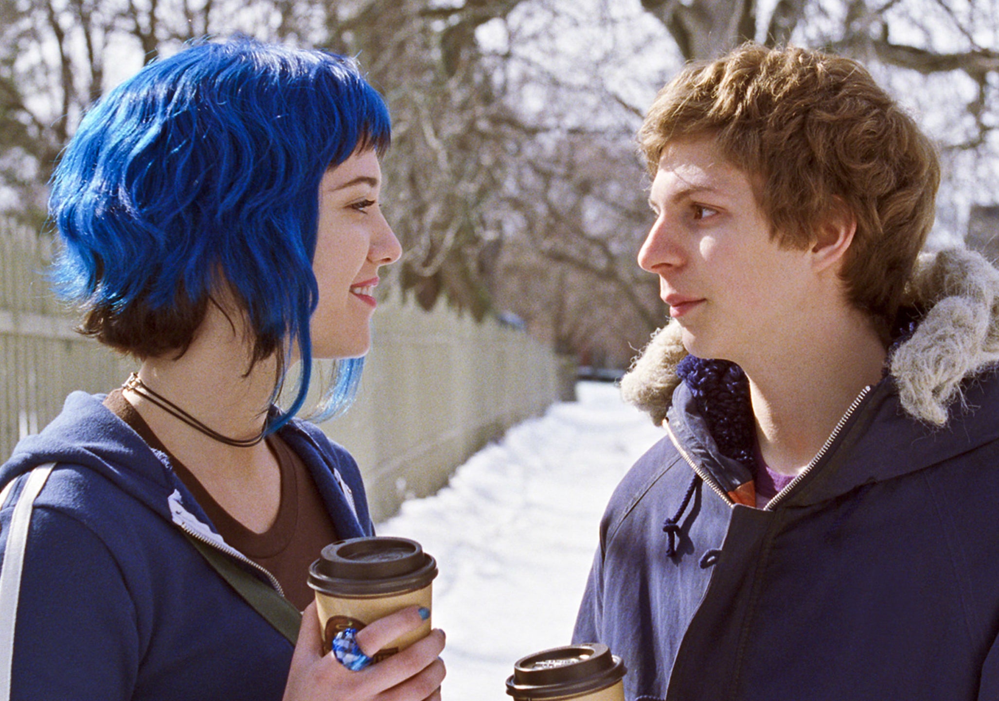 mary elizabeth winstead as Ramona flowers in scott pilgrim vs. the world with dark blue hair with dark brown by the nape of her neck and who longer strands of blue hair framing her face